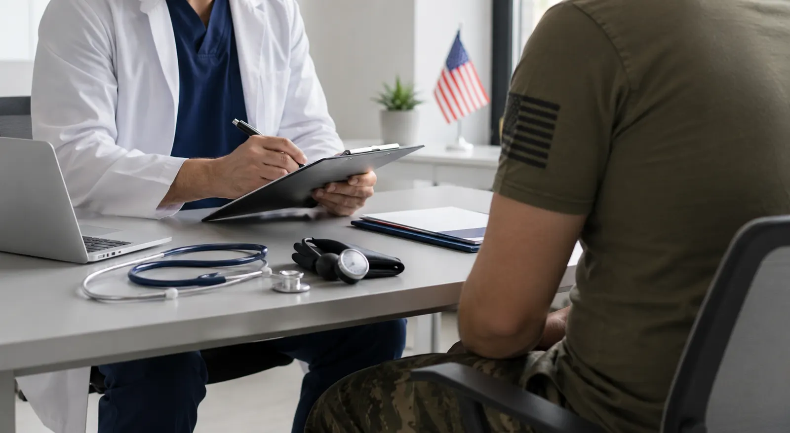 A medical examiner reviews documents with a veteran in uniform